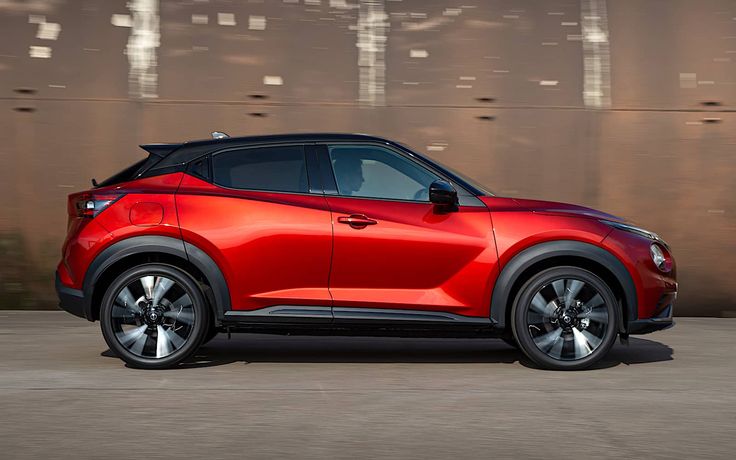 A picture of a Nissan Juke that is red in colour