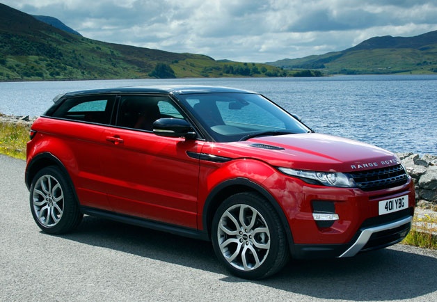 A picture of a Range Rover that is red in colour